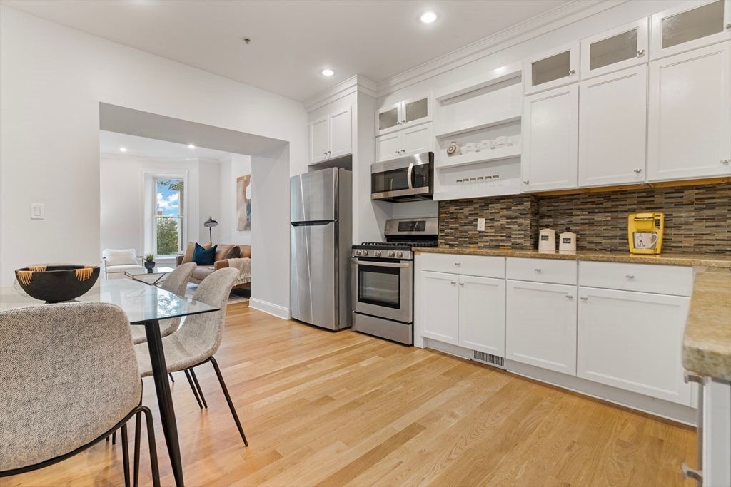 Dining room, Interior, Kitchen, Recessed Lighting, Stainless Steel Appliances, Wood Texture Flooring