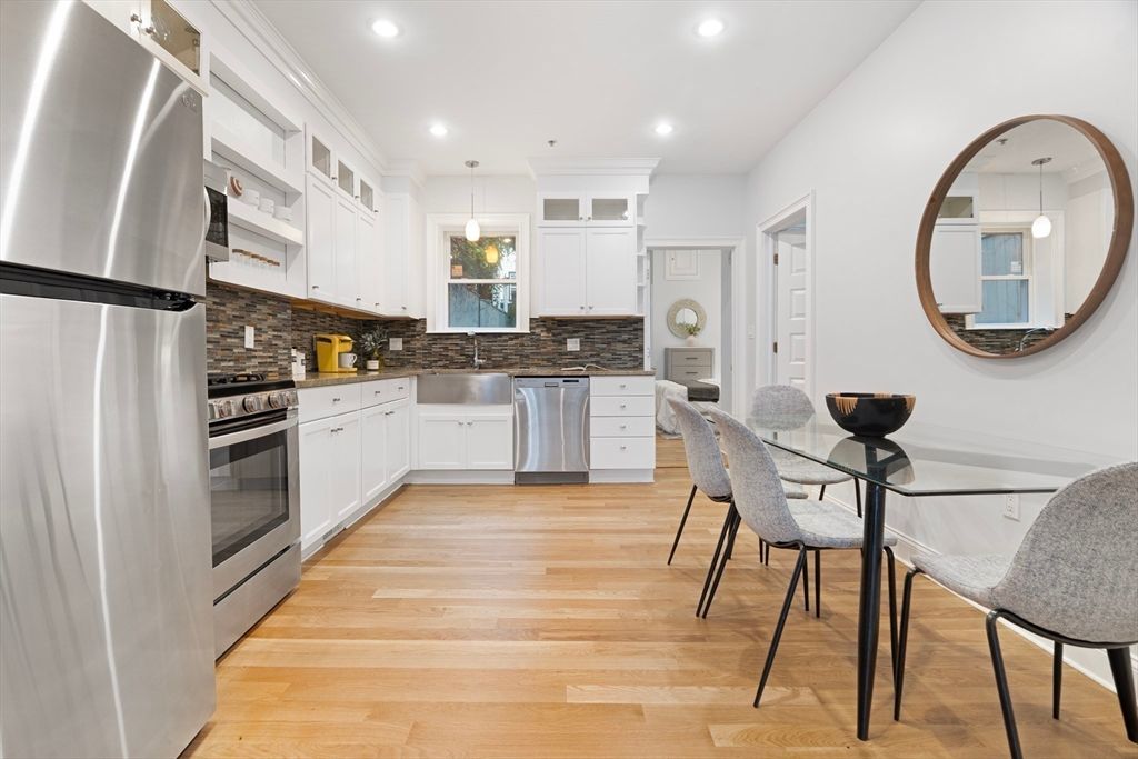Dining room, Interior, Kitchen, Pendant Lights, Recessed Lighting, Stainless Steel Appliances, Wood Texture Flooring