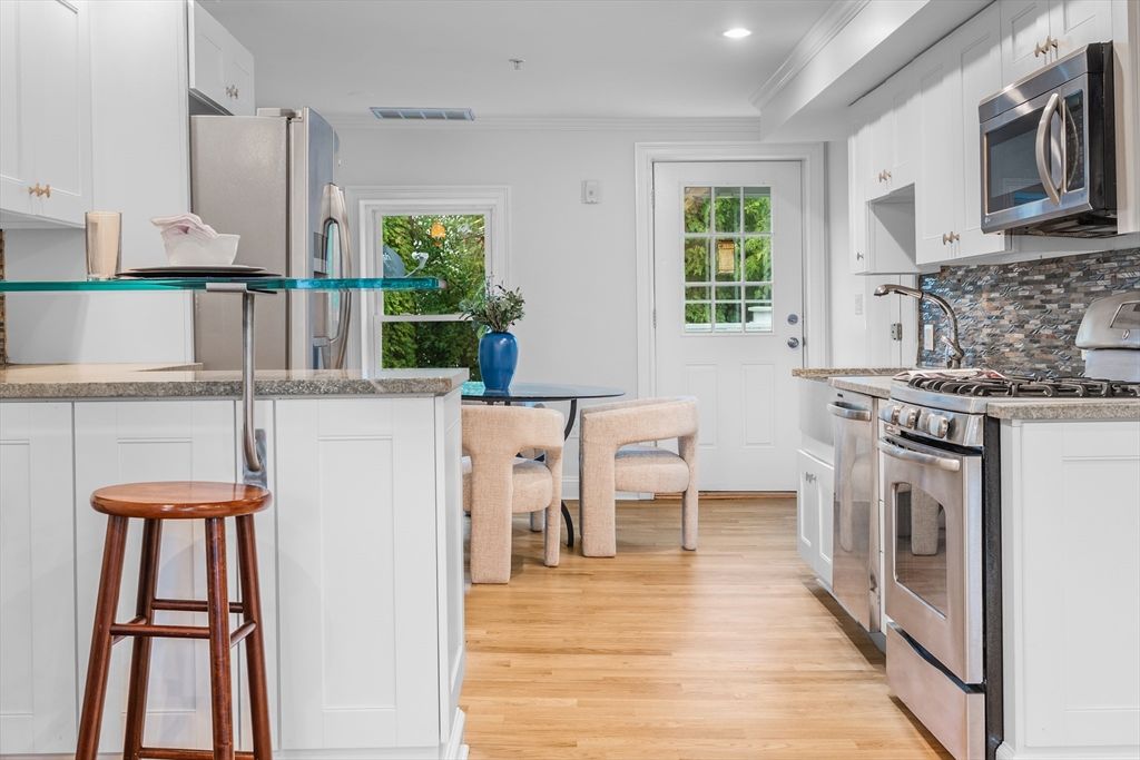 Dining room, Interior, Kitchen, Recessed Lighting, Stainless Steel Appliances, Wood Texture Flooring