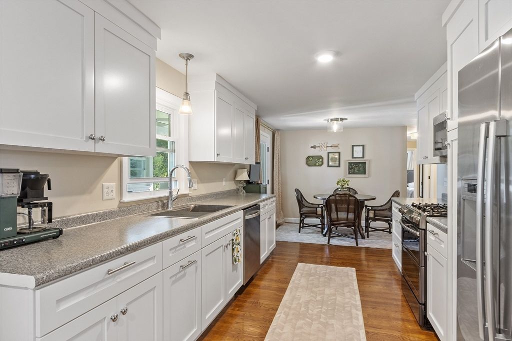Dining room, Interior, Kitchen, Pendant Lights, Recessed Lighting, Stainless Steel Appliances, Wood Texture Flooring