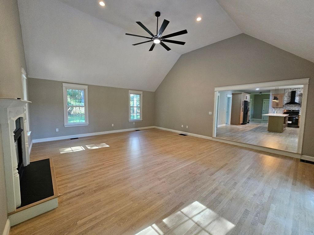 Empty room, Fireplace, Interior, Kitchen, Pendant Lights, Recessed Lighting, Wood Texture Flooring