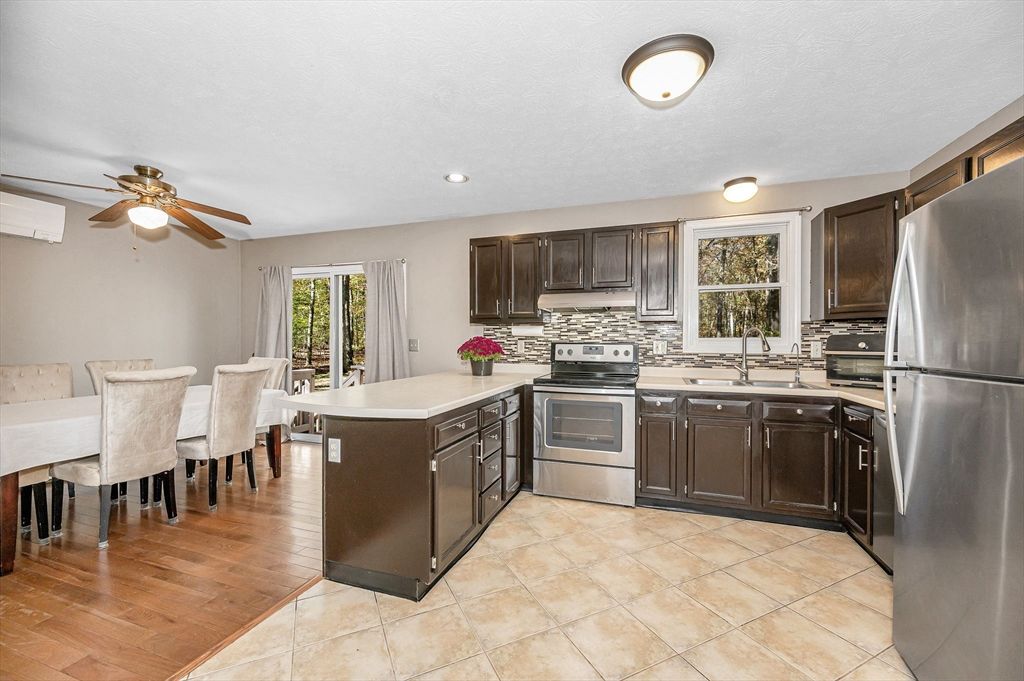 Dining room, Interior, Kitchen, Recessed Lighting, Stainless Steel Appliances, Wood Texture Flooring