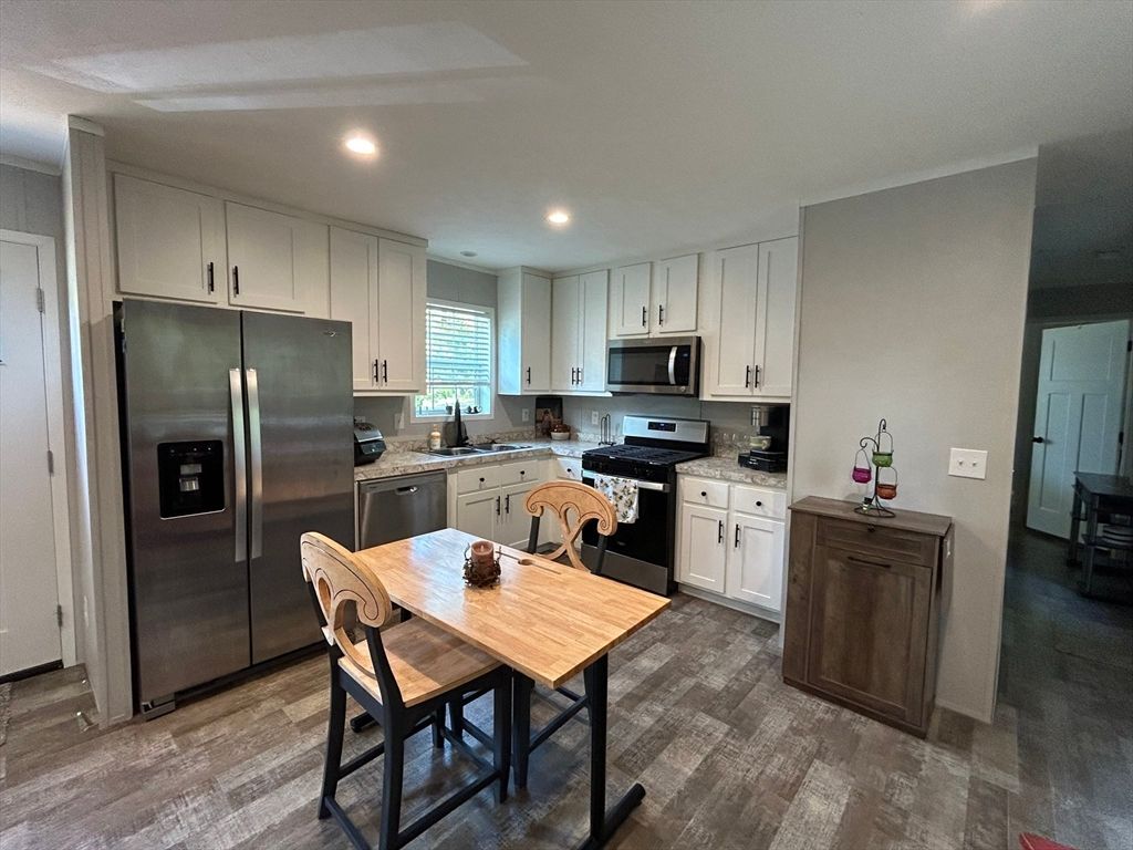 Dining room, Interior, Kitchen, Recessed Lighting, Stainless Steel Appliances, Wood Texture Flooring
