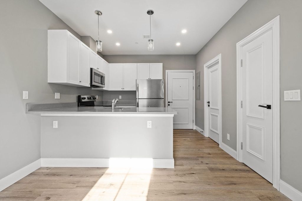 Interior, Kitchen, Pendant Lights, Recessed Lighting, Stainless Steel Appliances, Wood Texture Flooring