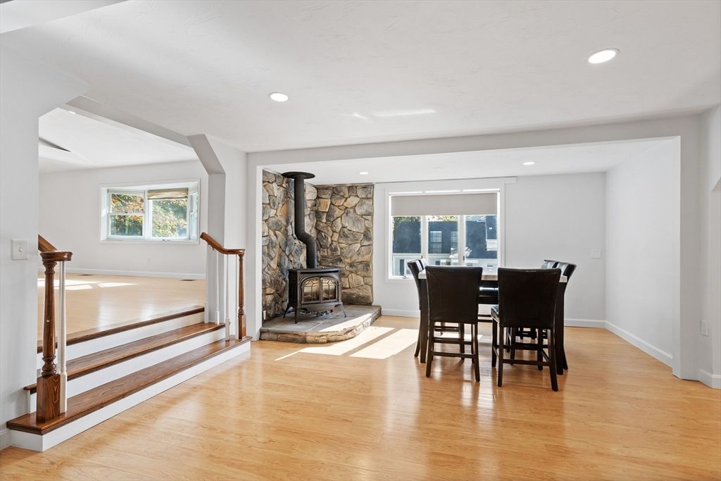 Dining room, Fireplace, Interior, Recessed Lighting, Stone Walls, Wood Texture Flooring