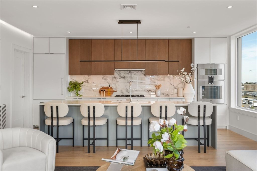 Interior, Kitchen, Marble Walls, Recessed Lighting, Stainless Steel Appliances, Wood Texture Flooring