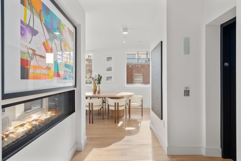 Dining room, Elevator, Fireplace, Interior, Recessed Lighting, Wood Texture Flooring