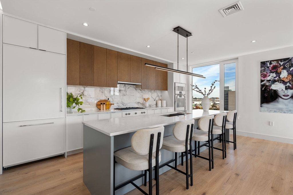 Interior, Kitchen, Marble Walls, Pendant Lights, Recessed Lighting, Stainless Steel Appliances, Wood Texture Flooring