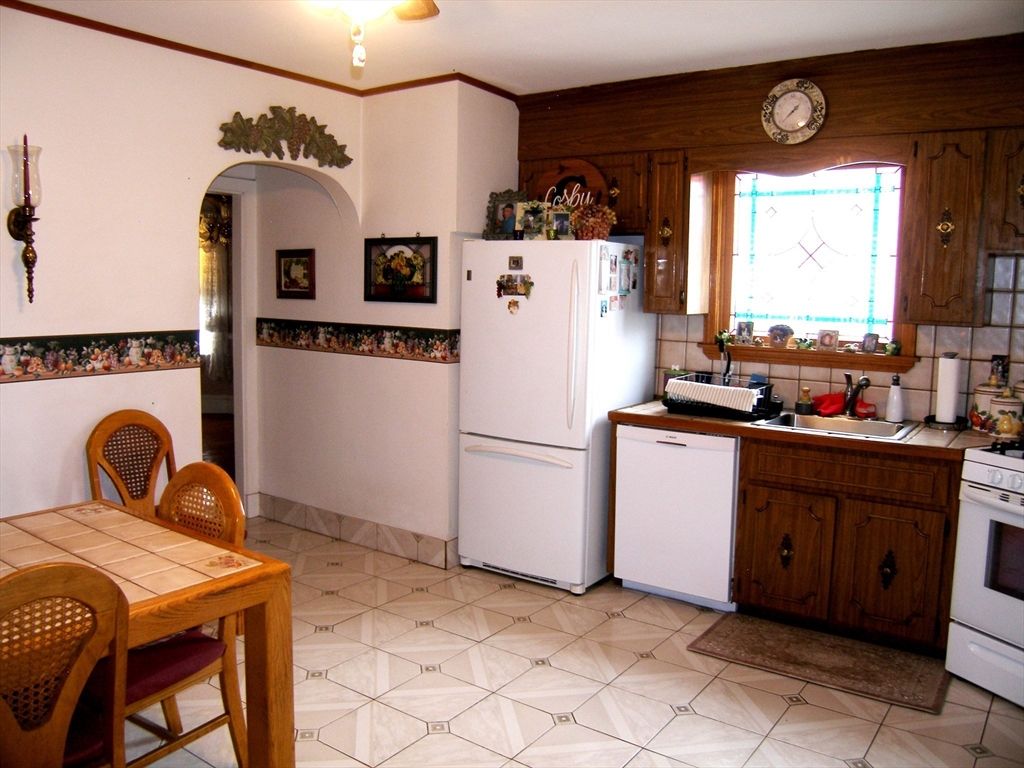 Interior, Kitchen, Tile Countertops, Washer, Wooden Walls