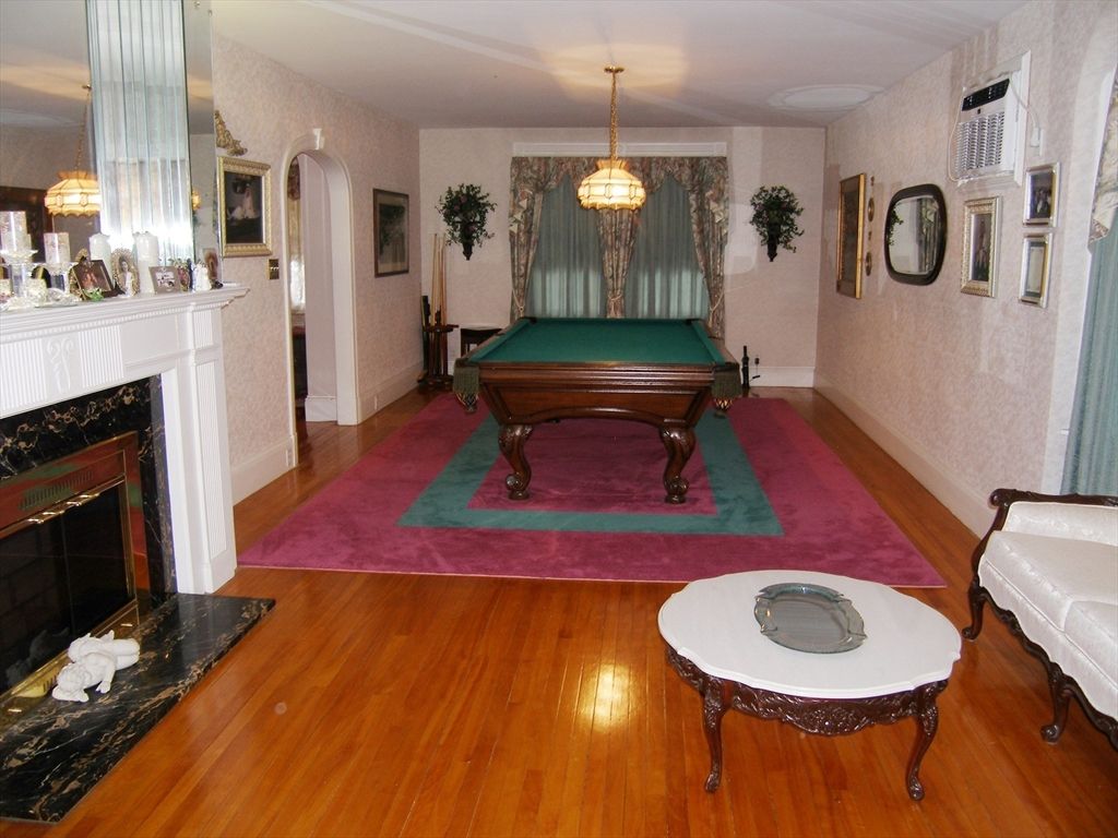 Billiard Table, Fireplace, Game Room, Interior, Pendant Lights, Wood Texture Flooring