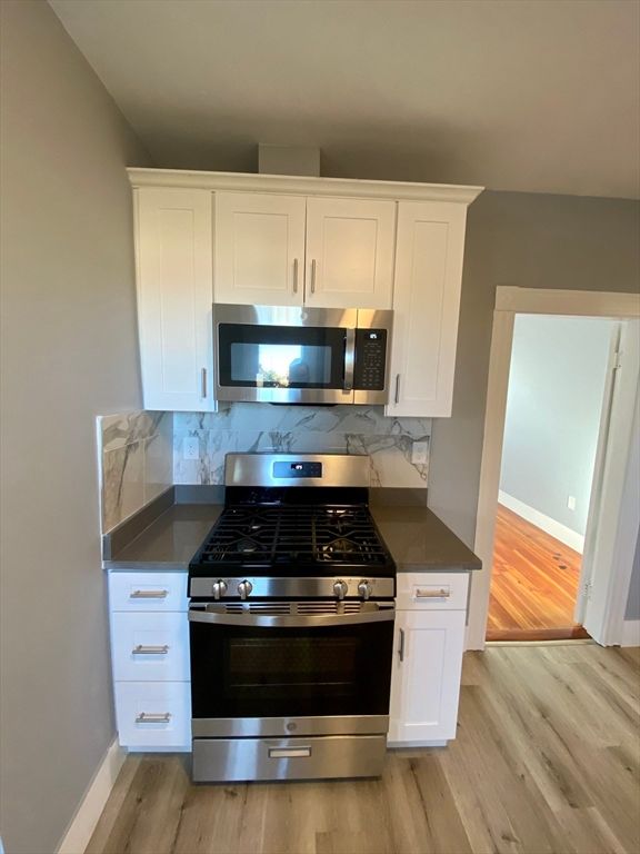 Interior, Kitchen, Marble Walls, Stainless Steel Appliances, Wood Texture Flooring