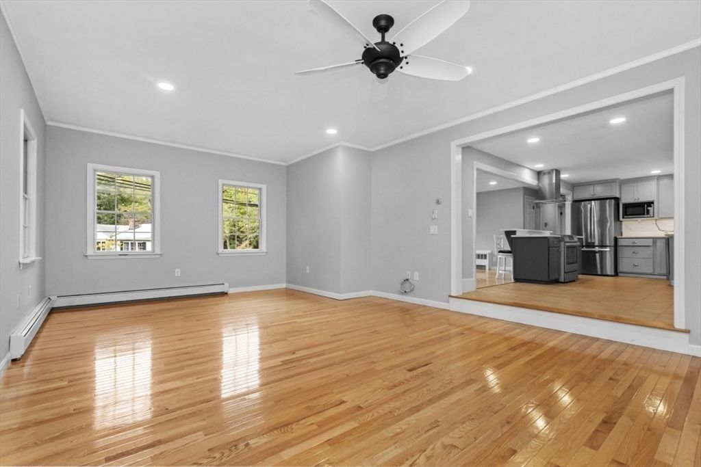 Empty room, Interior, Kitchen, Recessed Lighting, Stainless Steel Appliances, Wood Texture Flooring