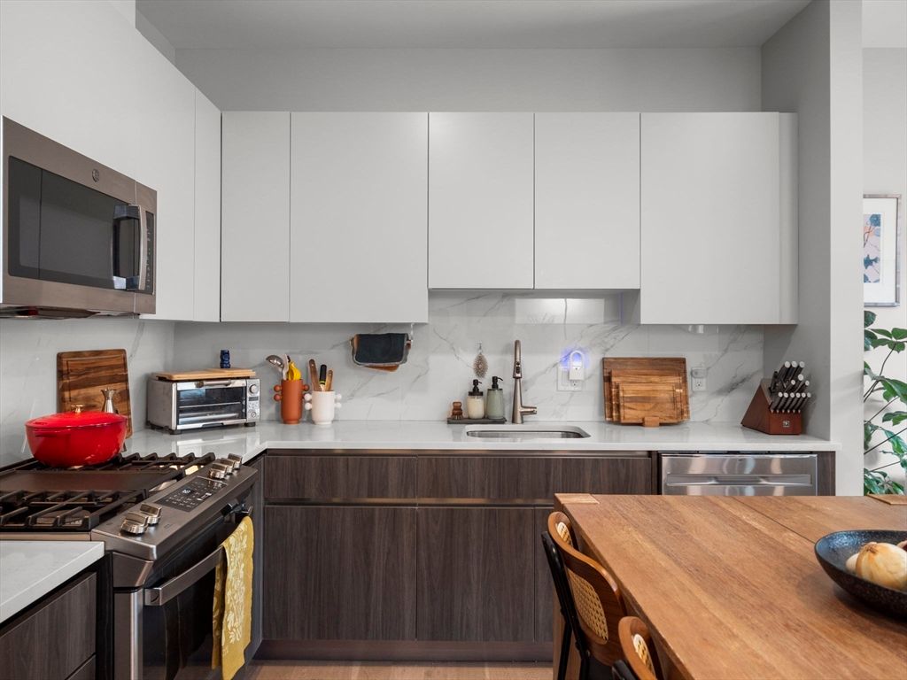 Interior, Kitchen, Marble Walls, Stainless Steel Appliances, Wood Texture Flooring