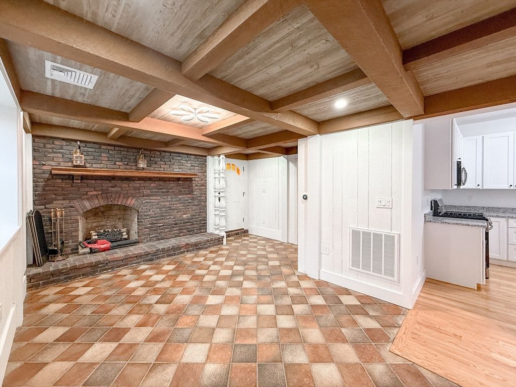 Empty room, Fireplace, Interior, Recessed Lighting, Stone Walls, Wooden Beams, Wooden Ceilings