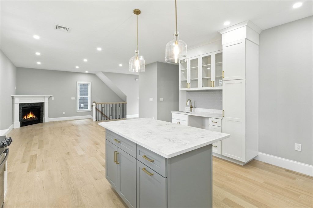 Empty room, Fireplace, Interior, Kitchen, Pendant Lights, Recessed Lighting, Wood Texture Flooring