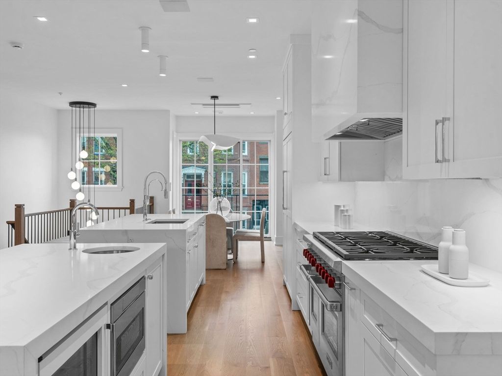 Interior, Kitchen, Marble Walls, Pendant Lights, Recessed Lighting, Stainless Steel Appliances, Wood Texture Flooring