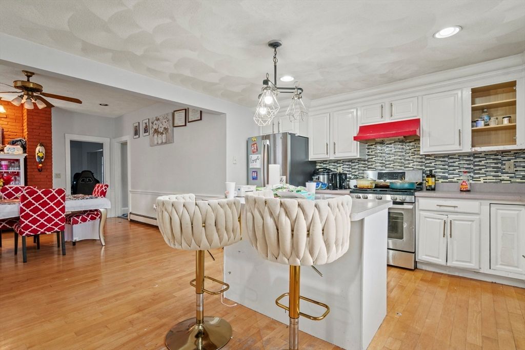 Dining room, Interior, Kitchen, Pendant Lights, Recessed Lighting, Stainless Steel Appliances, Wood Texture Flooring