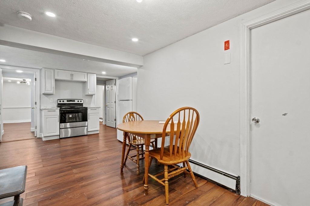 Dining room, Interior, Kitchen, Recessed Lighting, Stainless Steel Appliances, Wood Texture Flooring
