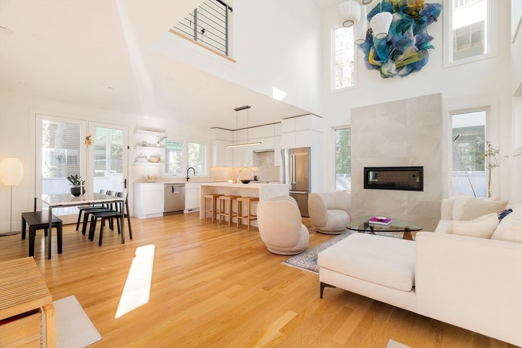 Dining room, Fireplace, Interior, Kitchen, Living room, Pendant Lights, Stainless Steel Appliances, Wood Texture Flooring