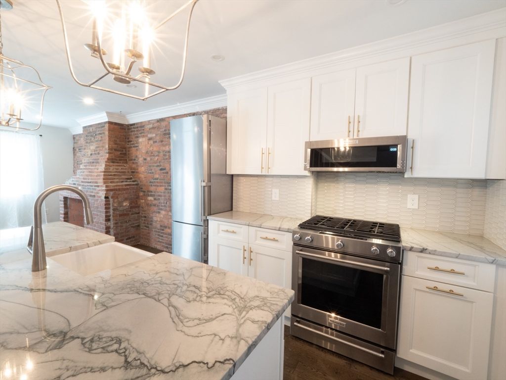 Interior, Kitchen, Recessed Lighting, Stainless Steel Appliances, Stone Walls, Wood Texture Flooring