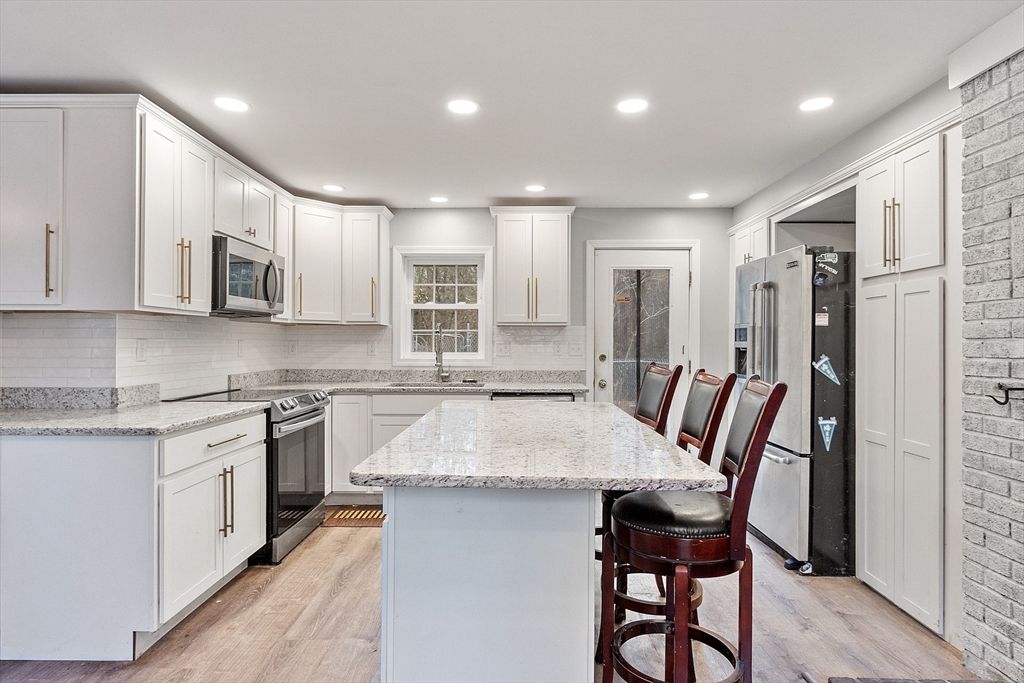 Interior, Kitchen, Recessed Lighting, Stainless Steel Appliances, Stone Walls, Wood Texture Flooring