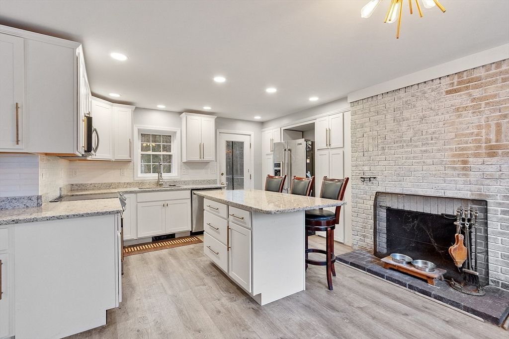 Fireplace, Interior, Kitchen, Recessed Lighting, Stone Walls, Wood Texture Flooring