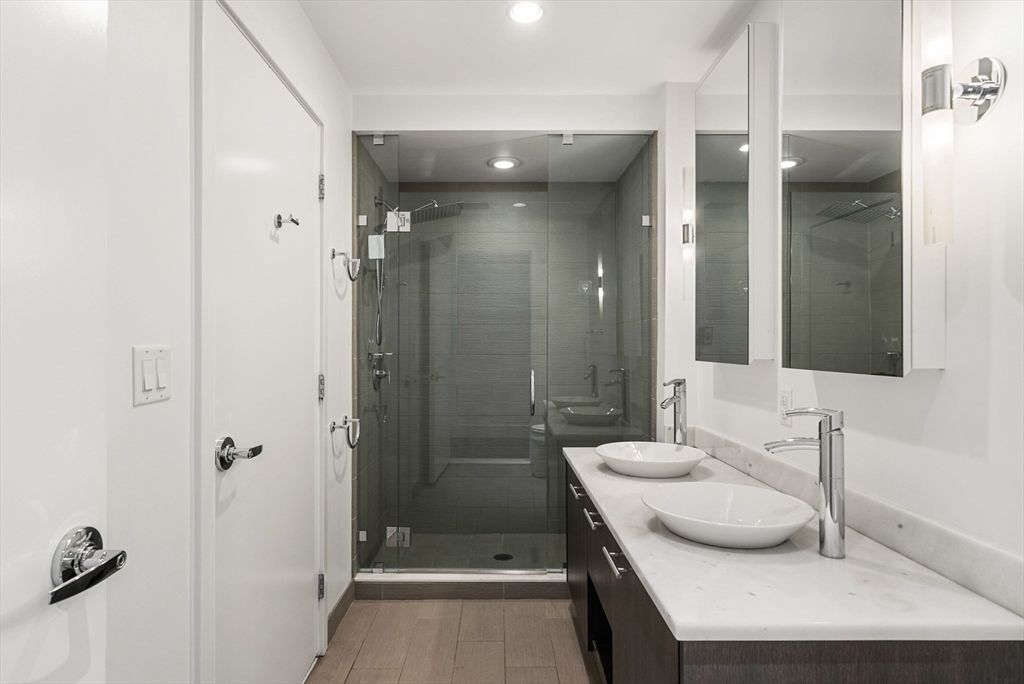Bathroom, Dual Sink Vanities, Glass Shower, Interior, Recessed Lighting, Wood Texture Flooring