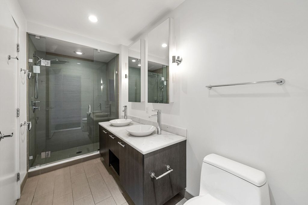 Bathroom, Dual Sink Vanities, Glass Shower, Interior, Recessed Lighting, Wood Texture Flooring