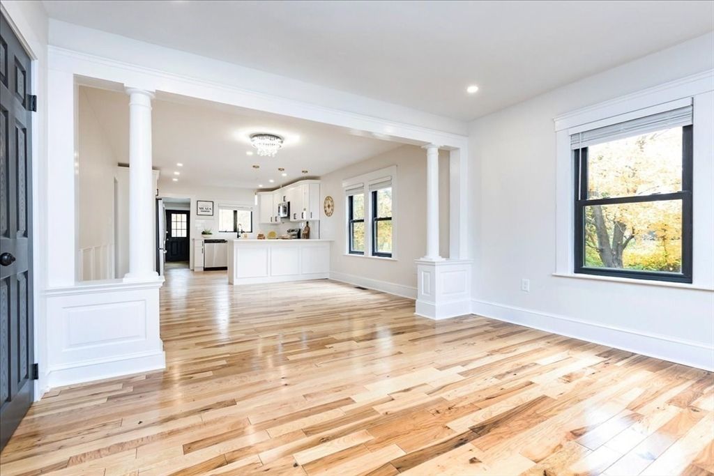 Empty room, Interior, Kitchen, Pendant Lights, Recessed Lighting, Stainless Steel Appliances, Wood Texture Flooring