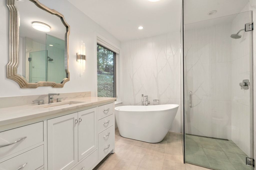 Bathroom, Dual Sink Vanities, Free Standing Baths, Glass Shower, Interior, Marble Walls, Recessed Lighting