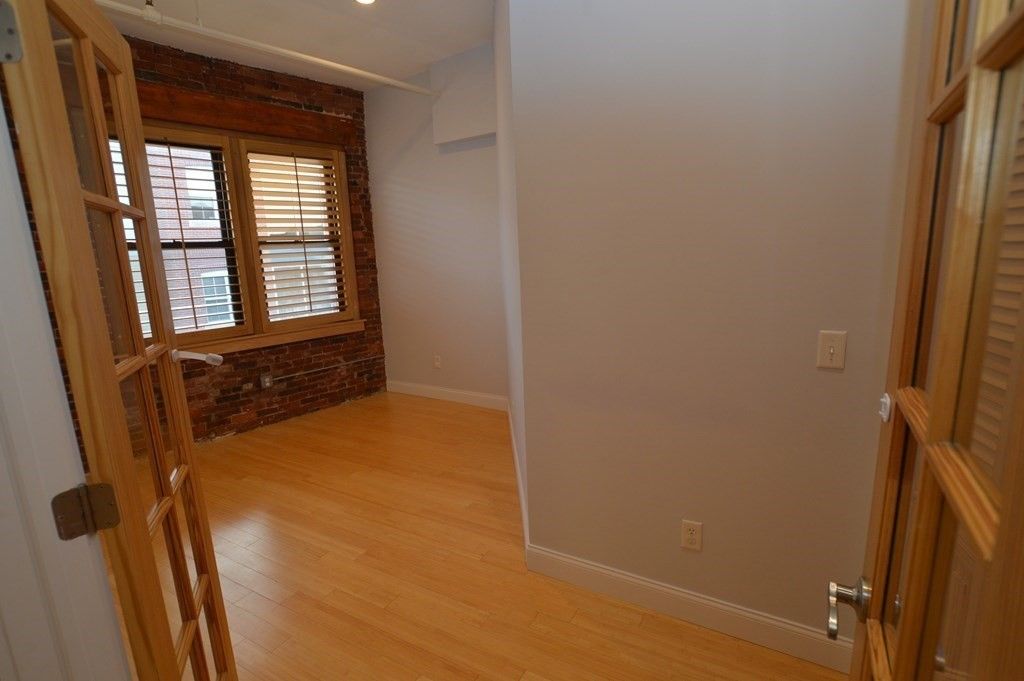Empty room, Interior, Recessed Lighting, Stone Walls, Wood Texture Flooring