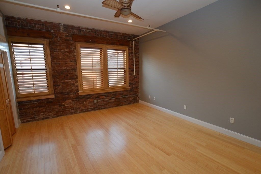 Empty room, Interior, Recessed Lighting, Stone Walls, Wood Texture Flooring