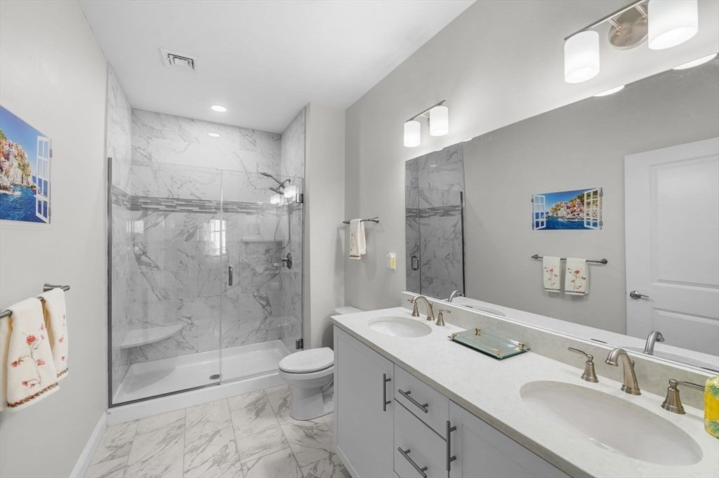 Bathroom, Dual Sink Vanities, Glass Shower, Interior, Marble, Marble Walls, Recessed Lighting