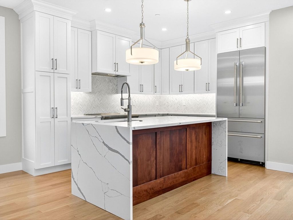 Interior, Kitchen, Marble Walls, Pendant Lights, Recessed Lighting, Stainless Steel Appliances, Wood Texture Flooring