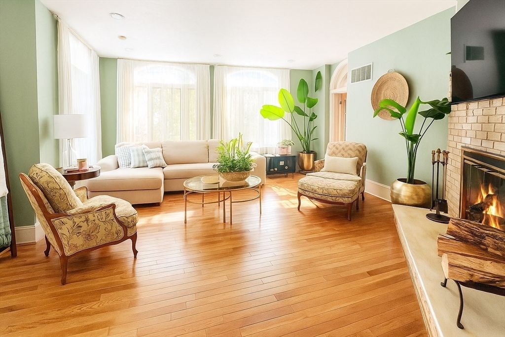 Fireplace, Interior, Living room, Recessed Lighting, Stone Walls, Wood Texture Flooring