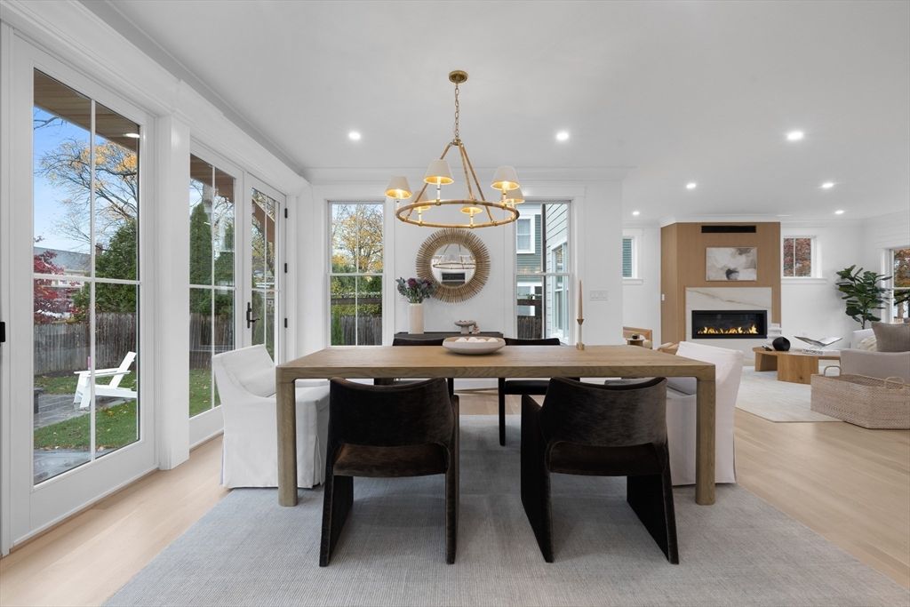 Chandelier, Dining room, Fireplace, Interior, Living room, Pendant Lights, Recessed Lighting, Wood Texture Flooring