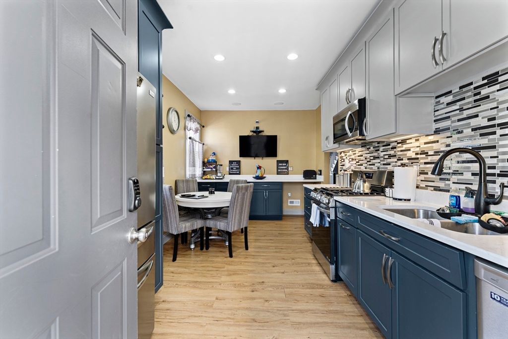Dining room, Interior, Kitchen, Recessed Lighting, Stainless Steel Appliances, Wood Texture Flooring