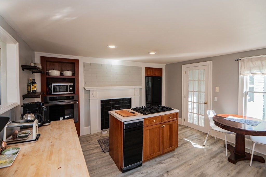 Dining room, Fireplace, Interior, Kitchen, Recessed Lighting, Wood Texture Flooring