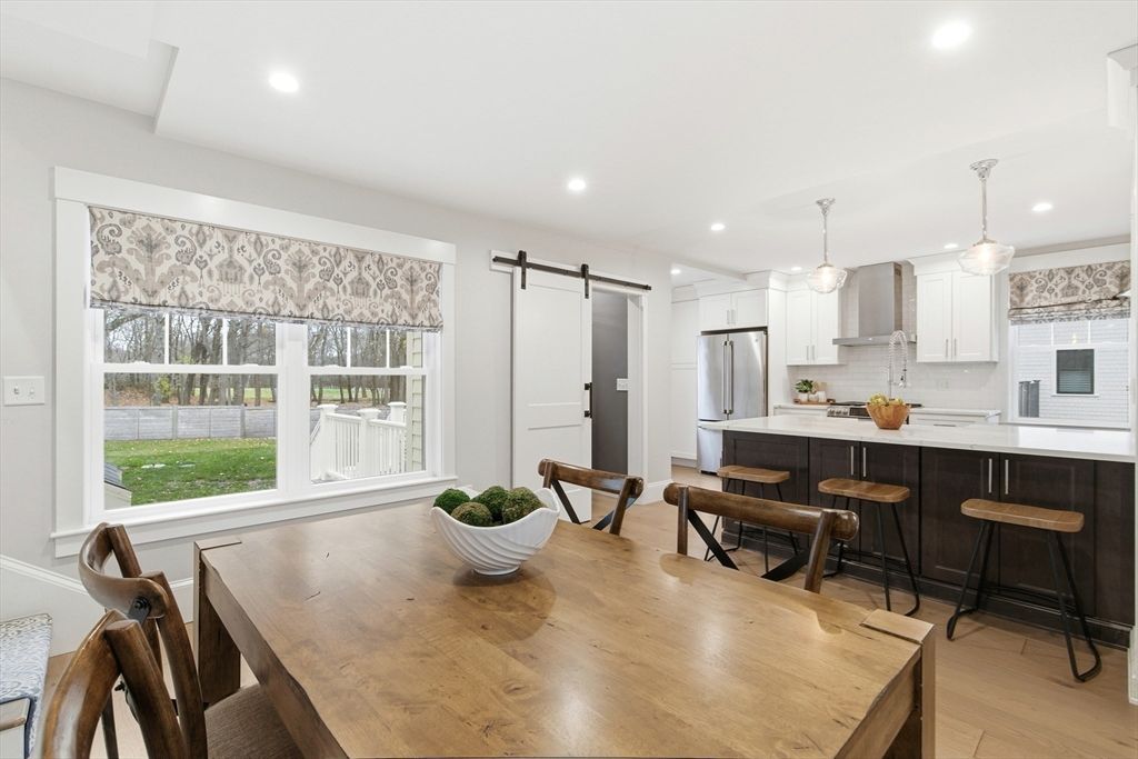 Dining room, Interior, Kitchen, Pendant Lights, Recessed Lighting, Stainless Steel Appliances, Wood Texture Flooring