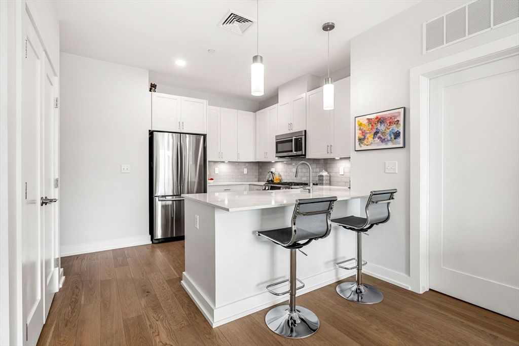 Interior, Kitchen, Pendant Lights, Recessed Lighting, Stainless Steel Appliances, Wood Texture Flooring