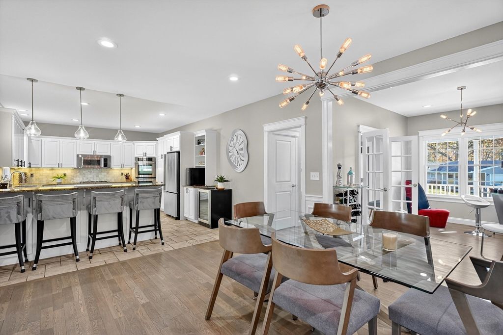 Dining room, Interior, Kitchen, Pendant Lights, Recessed Lighting, Stainless Steel Appliances, Wood Texture Flooring