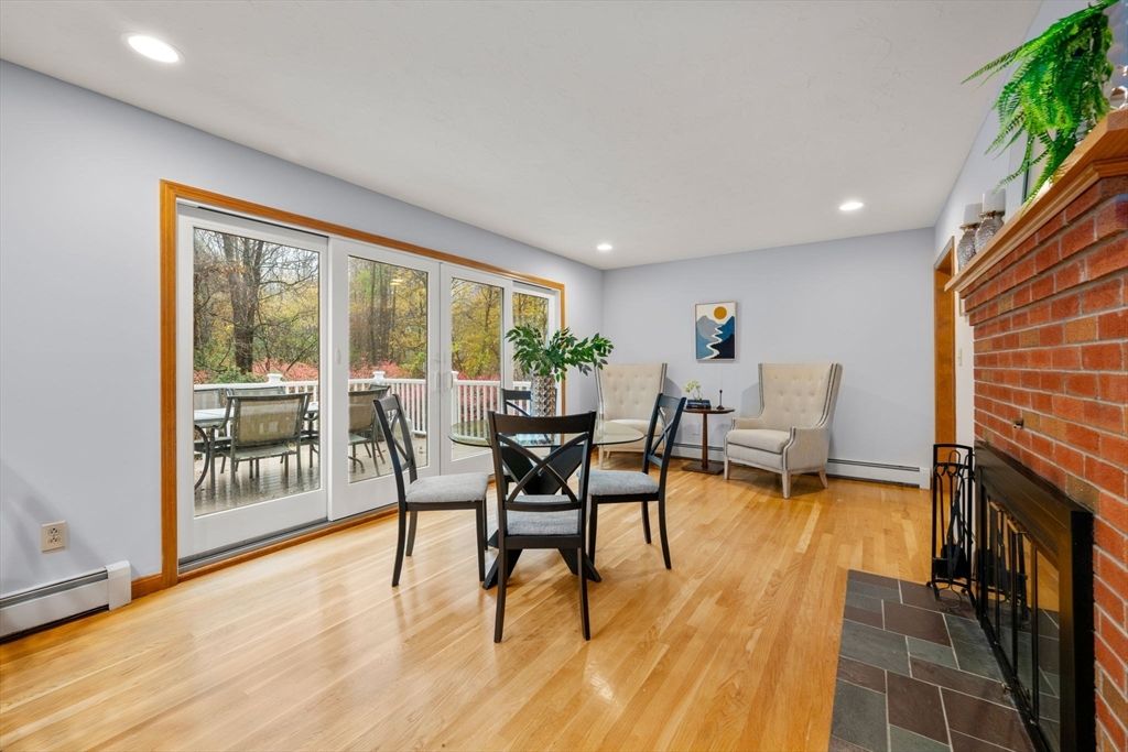 Dining room, Fireplace, Interior, Recessed Lighting, Stone Walls, Wood Texture Flooring