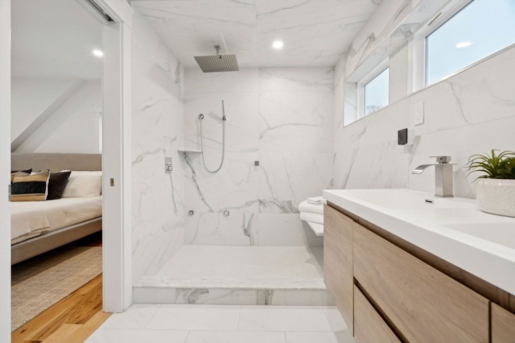 Bathroom, Bedroom, Dual Sink Vanities, Interior, Marble, Marble Walls, Recessed Lighting, Wood Texture Flooring