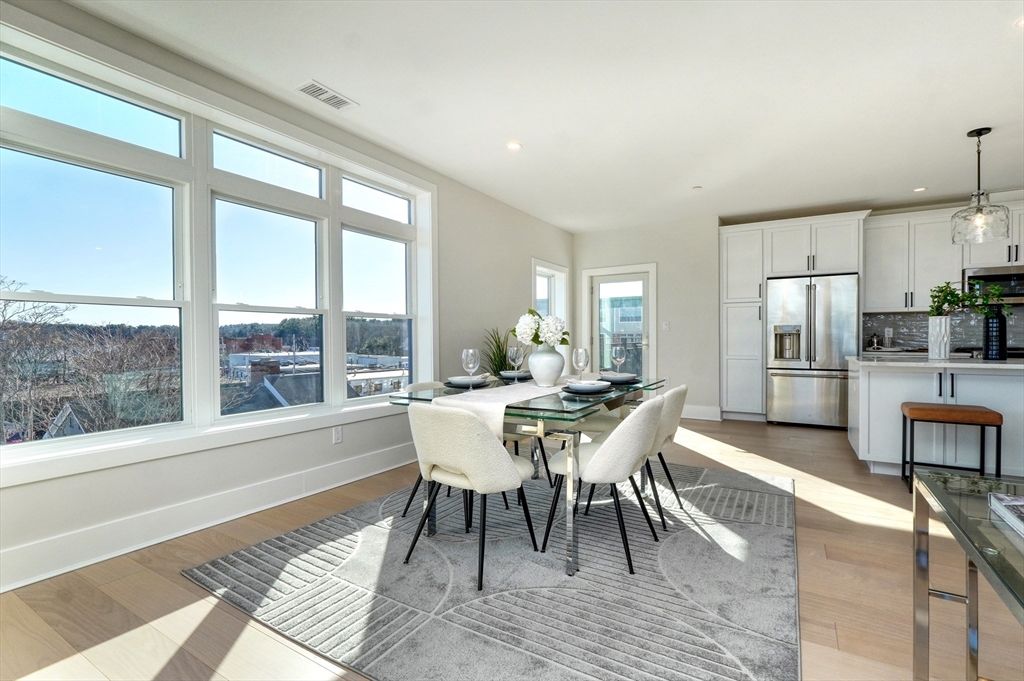 Dining room, Interior, Kitchen, Pendant Lights, Recessed Lighting, Stainless Steel Appliances, Wood Texture Flooring