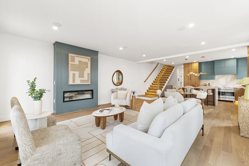 Dining room, Fireplace, Interior, Kitchen, Living room, Recessed Lighting, Stainless Steel Appliances, Wood Texture Flooring