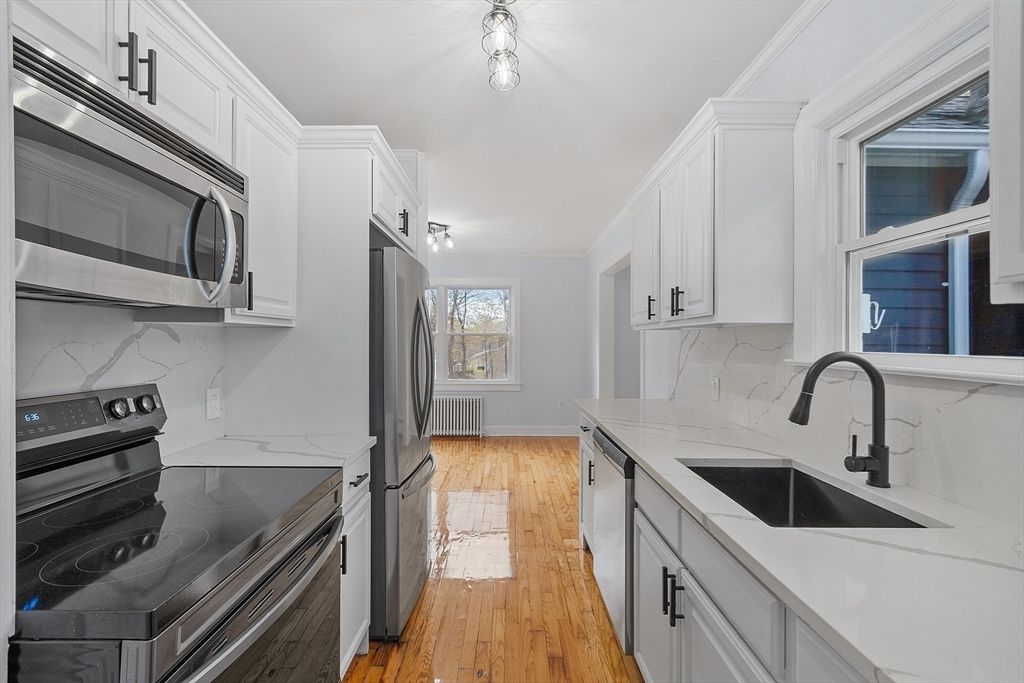 Interior, Kitchen, Marble Walls, Stainless Steel Appliances, Wood Texture Flooring