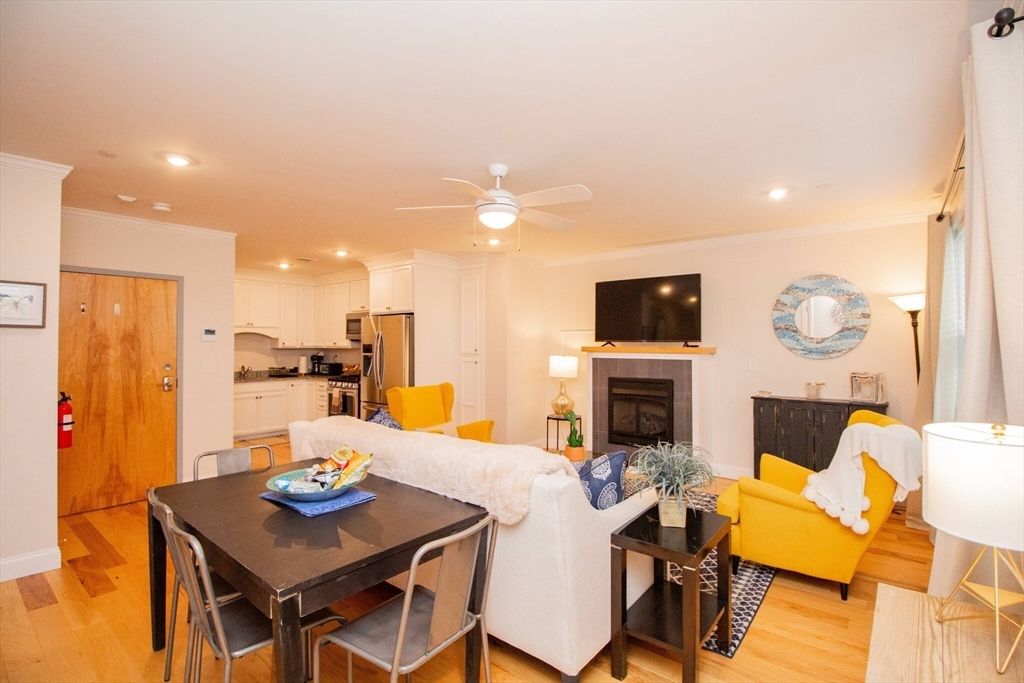 Dining room, Fireplace, Interior, Kitchen, Living room, Recessed Lighting, Stainless Steel Appliances, Wood Texture Flooring