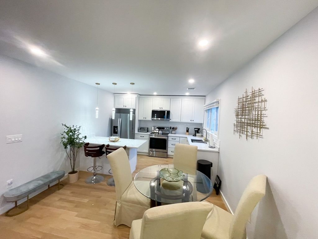 Dining room, Interior, Kitchen, Pendant Lights, Recessed Lighting, Stainless Steel Appliances, Wood Texture Flooring