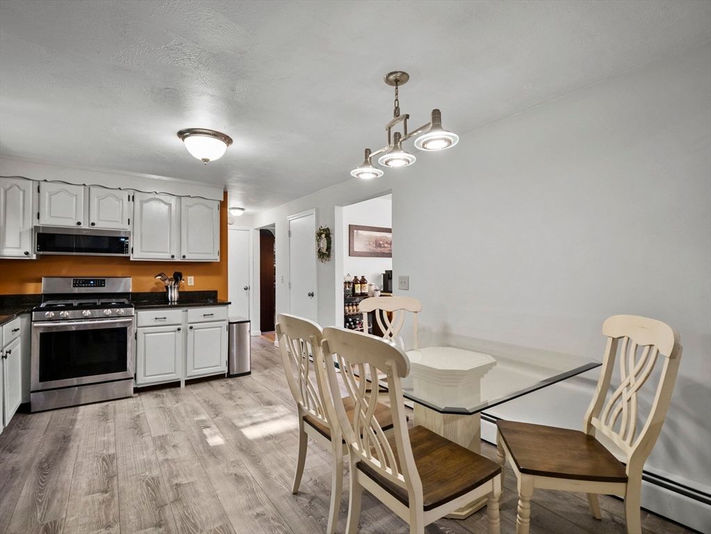 Dining room, Interior, Kitchen, Pendant Lights, Stainless Steel Appliances, Wood Texture Flooring