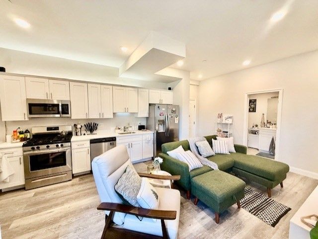 Fireplace, Interior, Kitchen, Living room, Recessed Lighting, Stainless Steel Appliances, Wood Texture Flooring